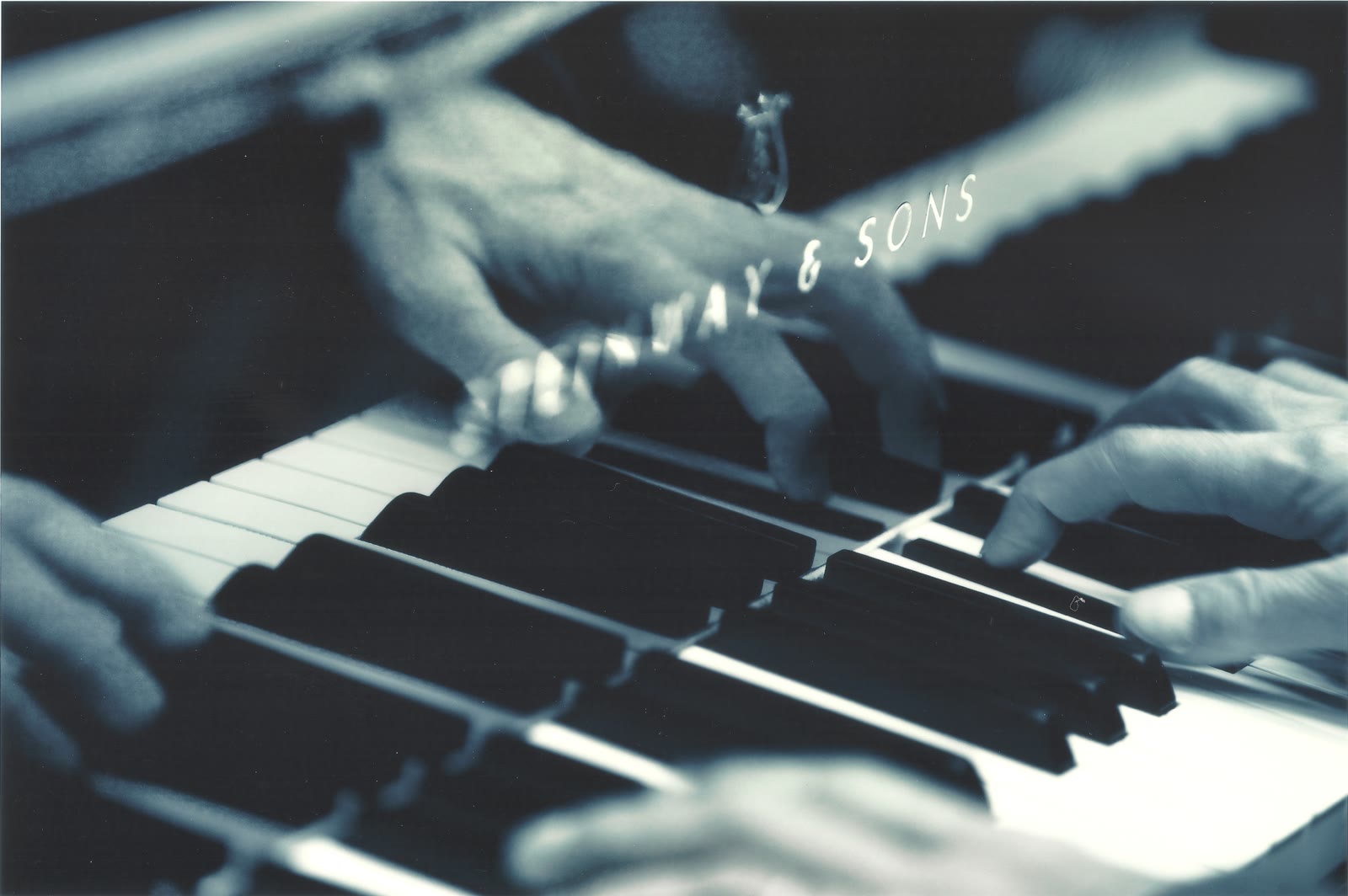 Hands at the keyboard of a Steinway & Sons grand piano — the original recording photograph