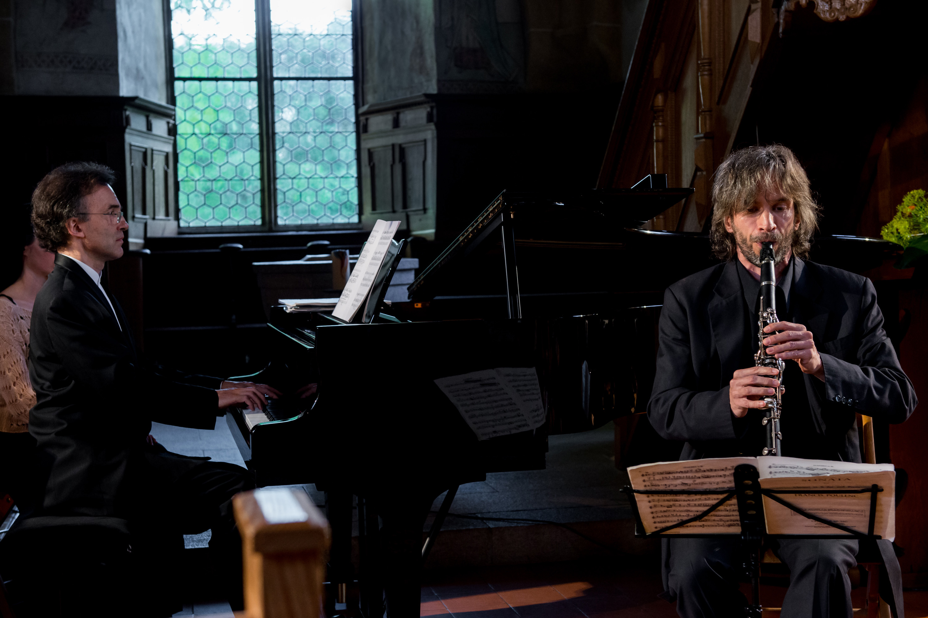 Vovka Ashkenazy at the piano performing with clarinettist Dimitri Ashkenazy in a church